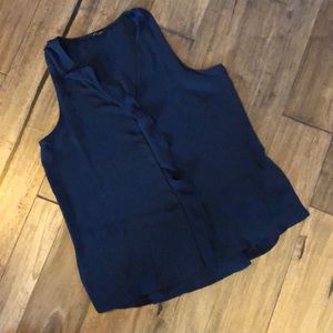 Navy blue ruffled sleeveless blouse.